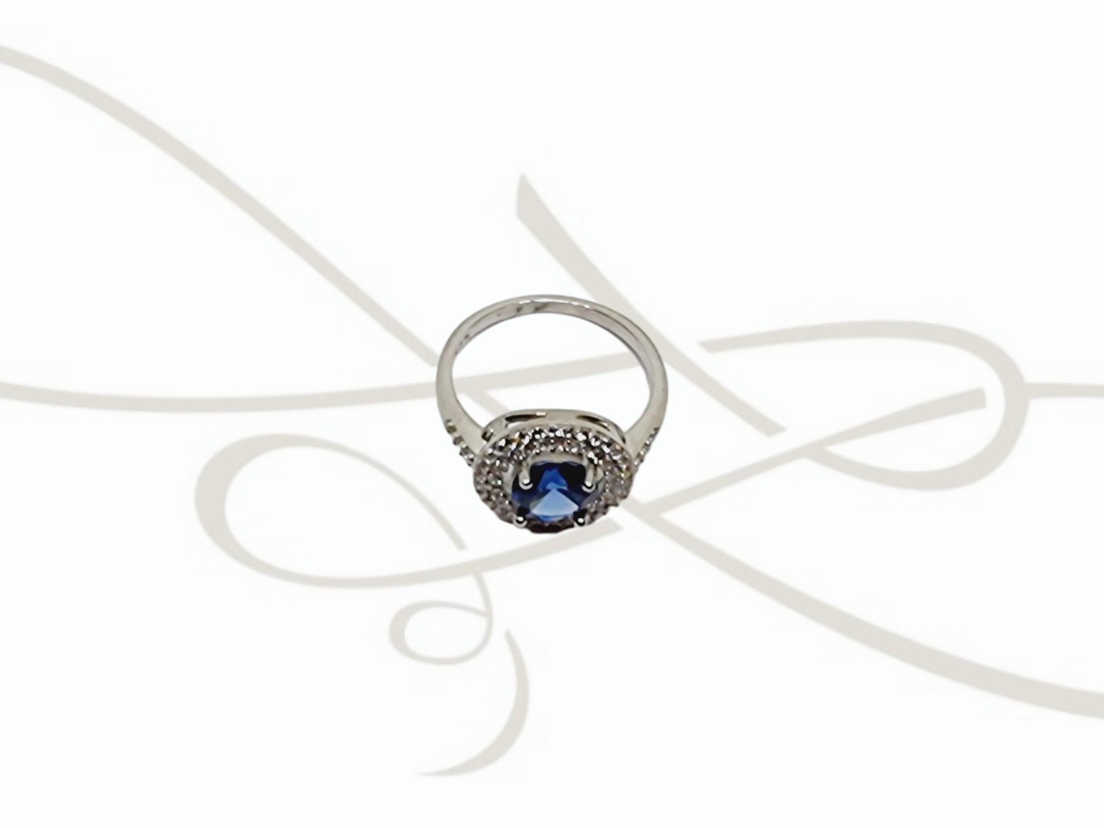 ANILLO PLATA RODIZADA ZAFIRO DOBLE HALO CON TOPACIO BLANCO