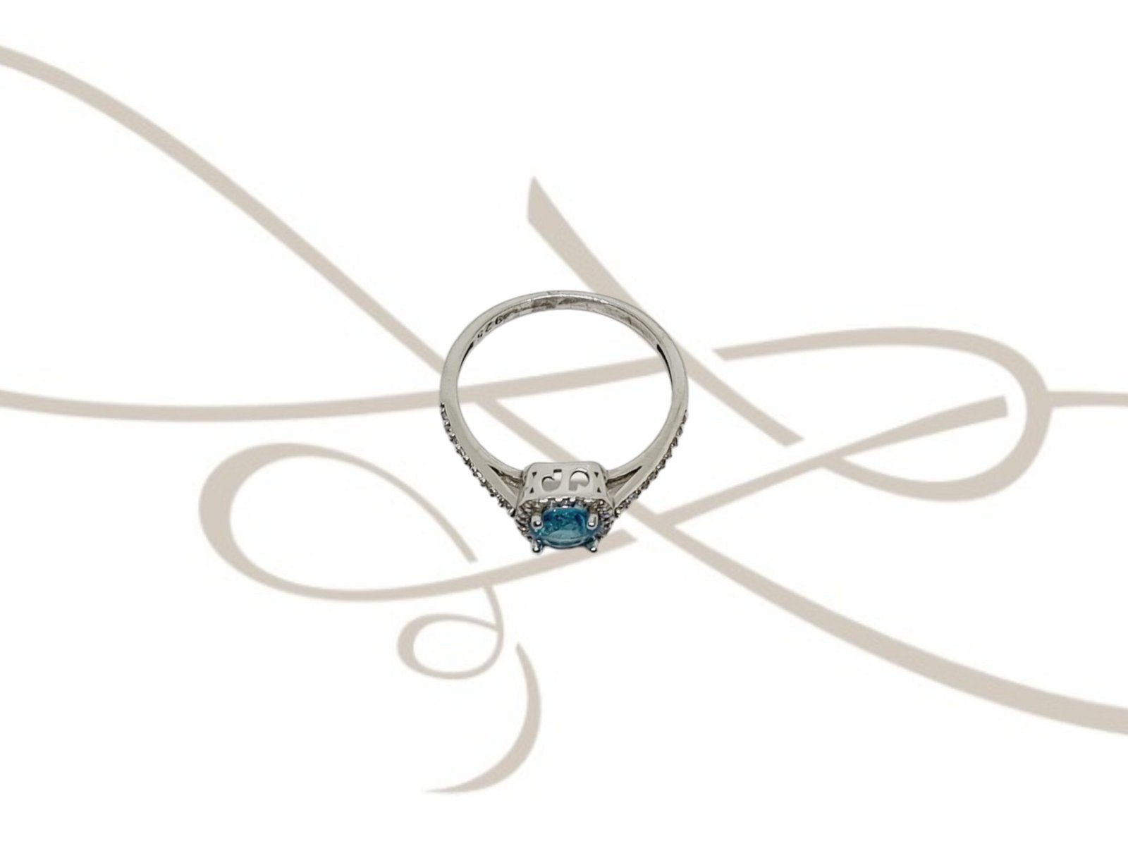 ANILLO PLATA RODIZADA CUADRO TOPACIO AZUL CON HALO