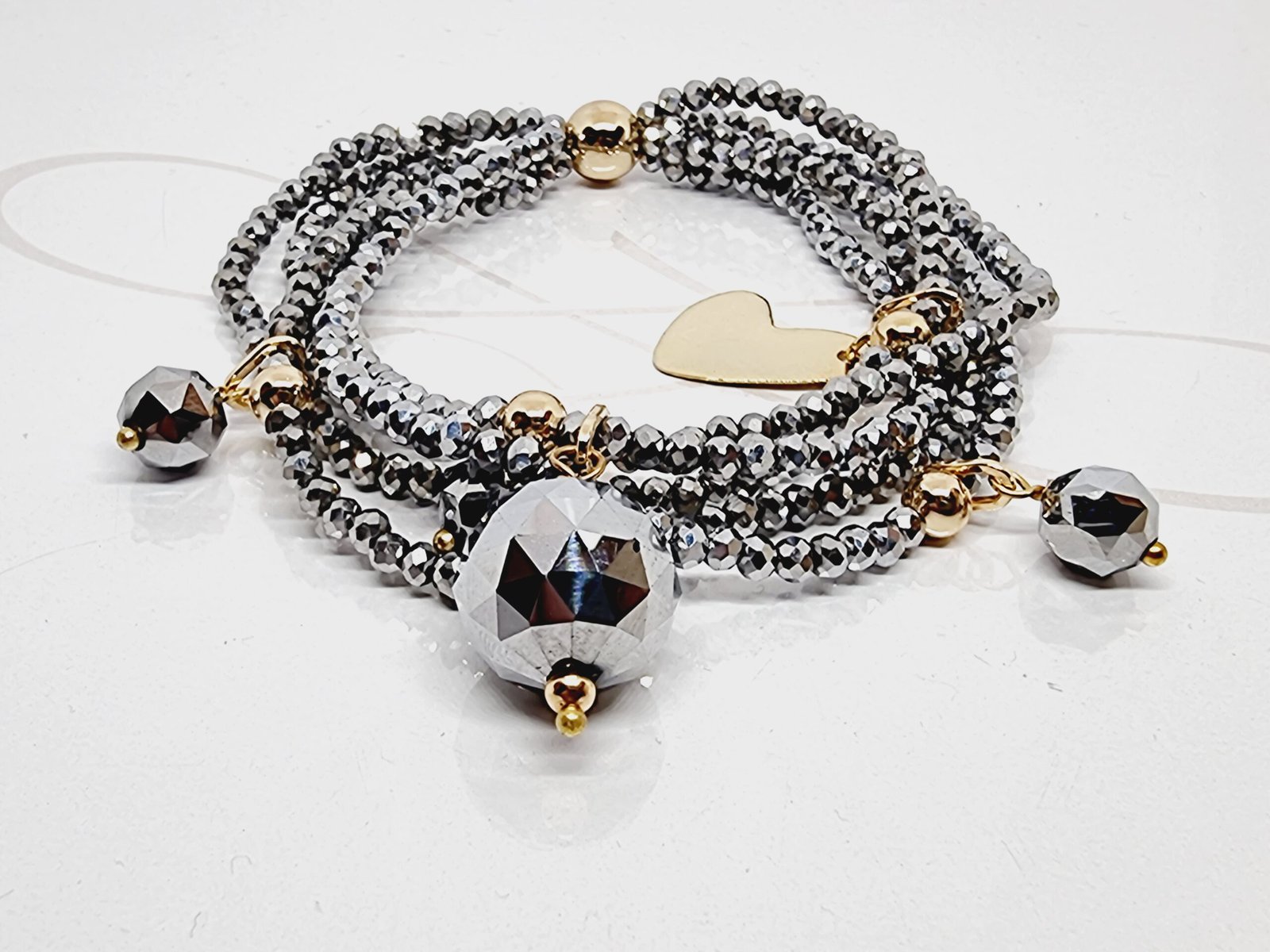 PULSERA CON DIJES QUINTUPLE HILO CRISTAL PLATEADO