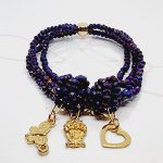 PULSERA CUADRUPLE CON DIJES VARIOS CRISTAL MORADO