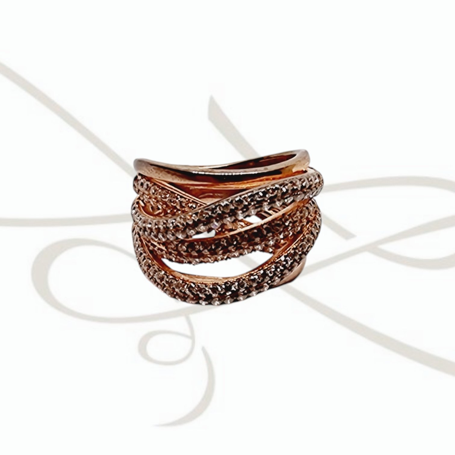 ANILLO PLATA RECUBRIMIENTO ORO ROSA CON ZIRCONIA Y LINEAS ENTRELAZADAS