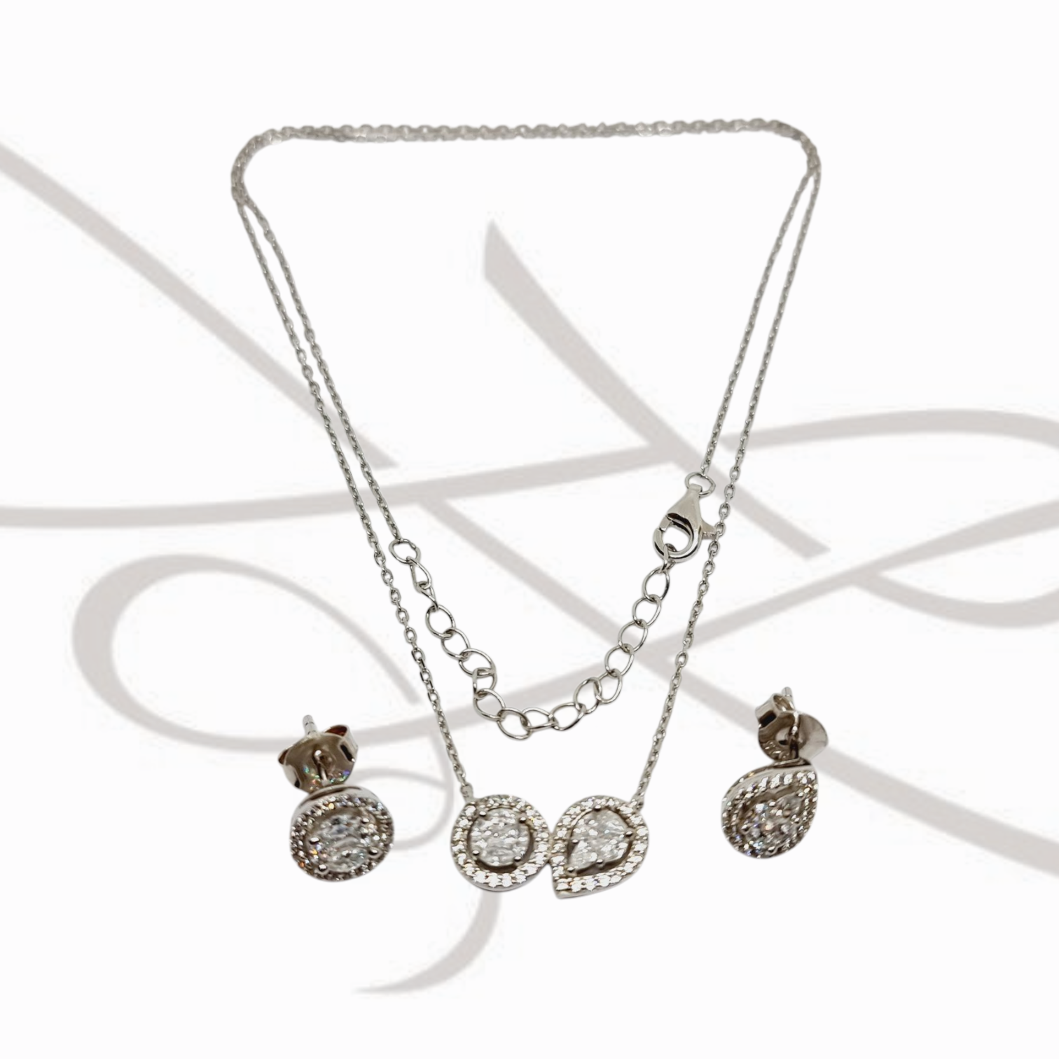 JUEGO PLATA RODIZADA CIRCULAR Y GOTA TOPACIO BLANCO