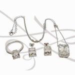 JUEGO PLATA RODIZADA RECTANGULO Y HALO MOISSANITE