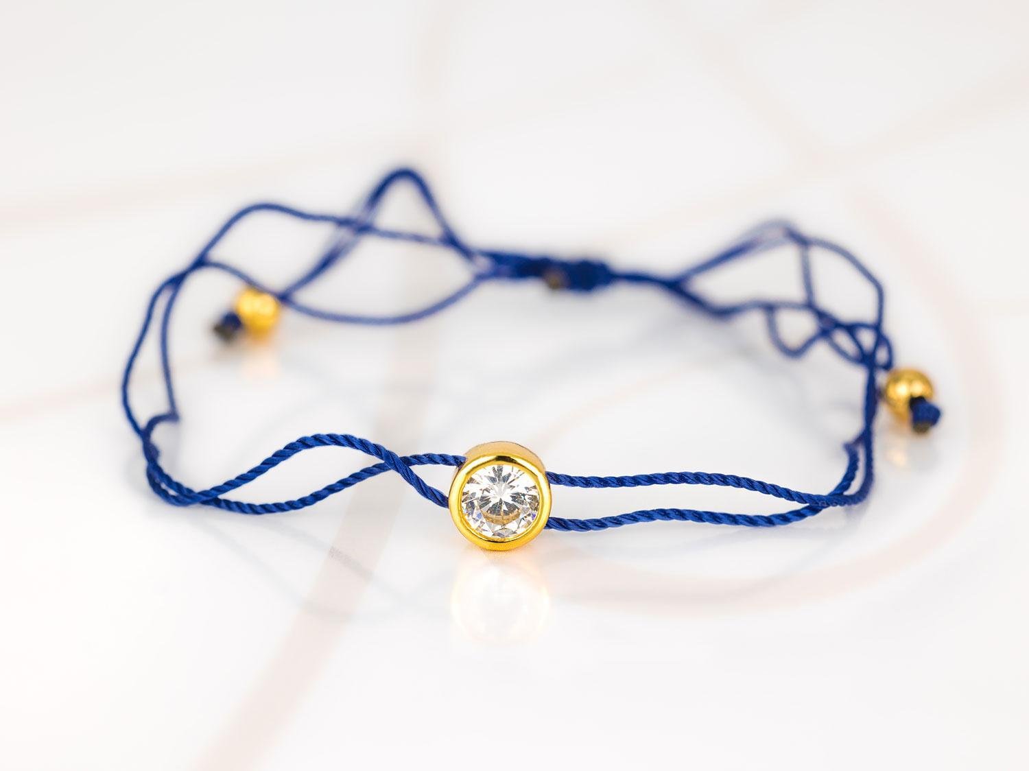 PULSERA CON DIJE BISUTERIA DORADO ZIRCONIA HILO