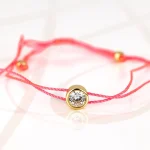 PULSERA CON DIJE BISUTERIA DORADO ZIRCONIA HILO