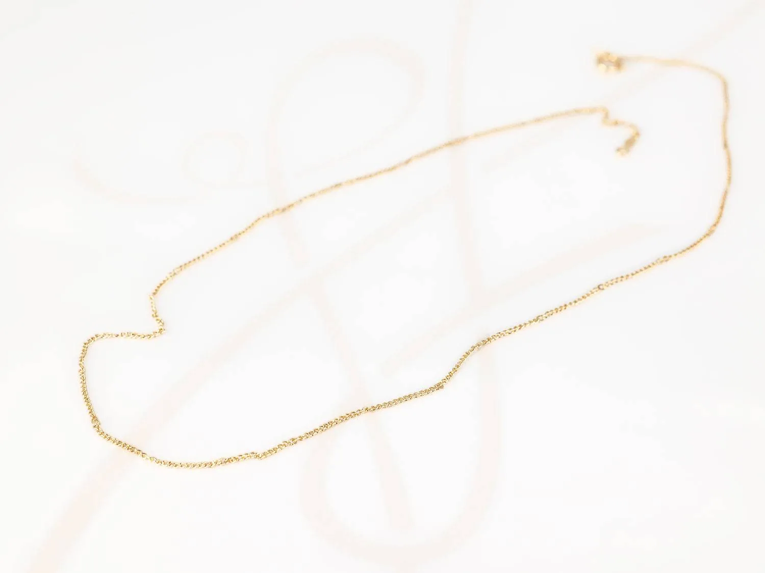 CADENA ORO LAMINADO MINI LISA FORZADA