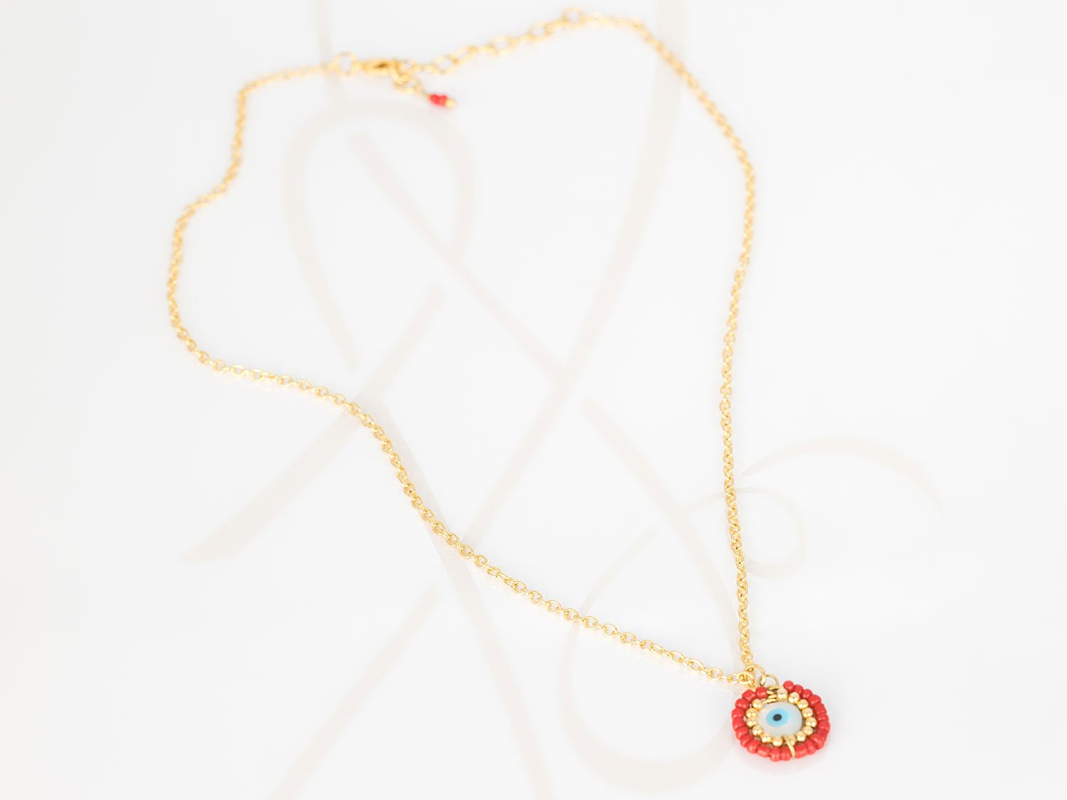 COLLAR CON DIJE ORO LAMINADO OJO CHAQUIRA CADENA