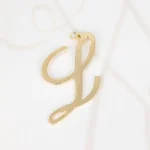 DIJE ORO LAMINADO CURSIVA L LISO