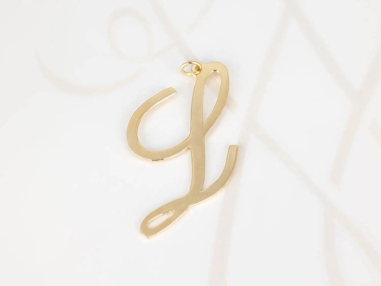 DIJE ORO LAMINADO CURSIVA L LISO