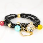 PULSERA CON DIJE ORO LAMINADO PIEDRA CORAZON CRISTAL