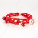 PULSERA CON DIJE ORO LAMINADO PIEDRA CORAZON CRISTAL