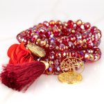 PULSERA CON DIJE ORO LAMINADO FLOR POMPON CRISTAL