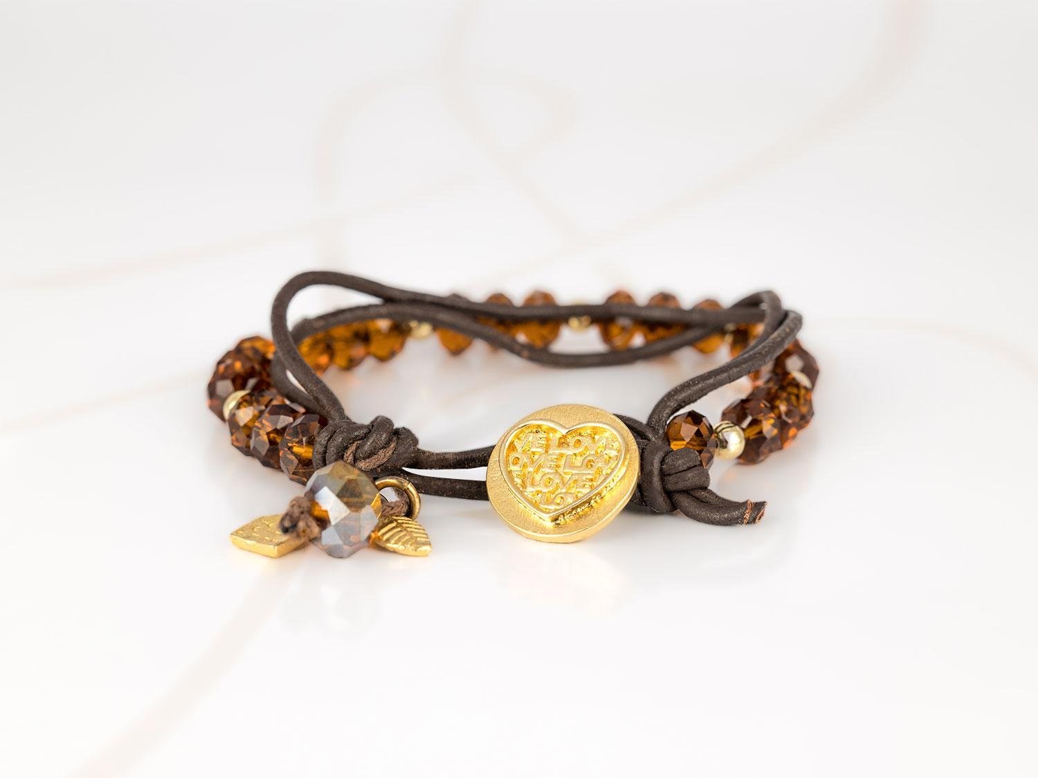 PULSERA CON DIJE ORO LAMINADO CRISTAL CORAZON PIEL
