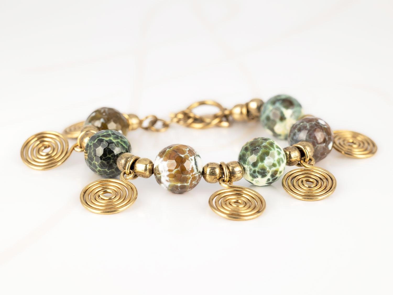 PULSERA CON DIJE ORO LAMINADO BOLAS ESPIRALES PIEDRA