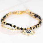 PULSERA CON DIJE ORO LAMINADO CHAQUIRA OJO ZIRCONIA