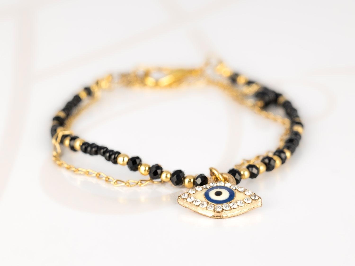 PULSERA CON DIJE ORO LAMINADO CHAQUIRA OJO ZIRCONIA