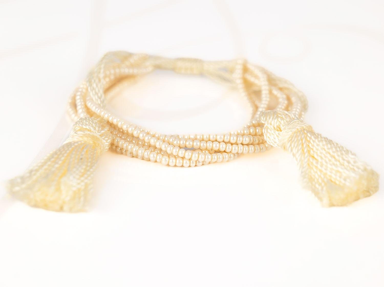 PULSERA SIN DIJE ORO LAMINADO CHAQUIRA POMPON HILO