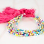 PULSERA SIN DIJE ORO LAMINADO CHAQUIRA POMPON HILO