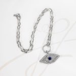 COLLAR PLATA RODIZADA OJO TURCO GRANDE TOPACIO BLANCO CON ZAFIRO