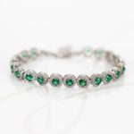 PULSERA PLATA RODIZADA CIRCULOS ESMERALDAS CON HALO TOPACIO BLANCO