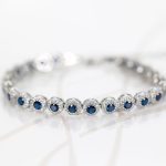 PULSERA PLATA RODIZADA CIRCULOS ZAFIRO CON HALO TOPACIO BLANCO