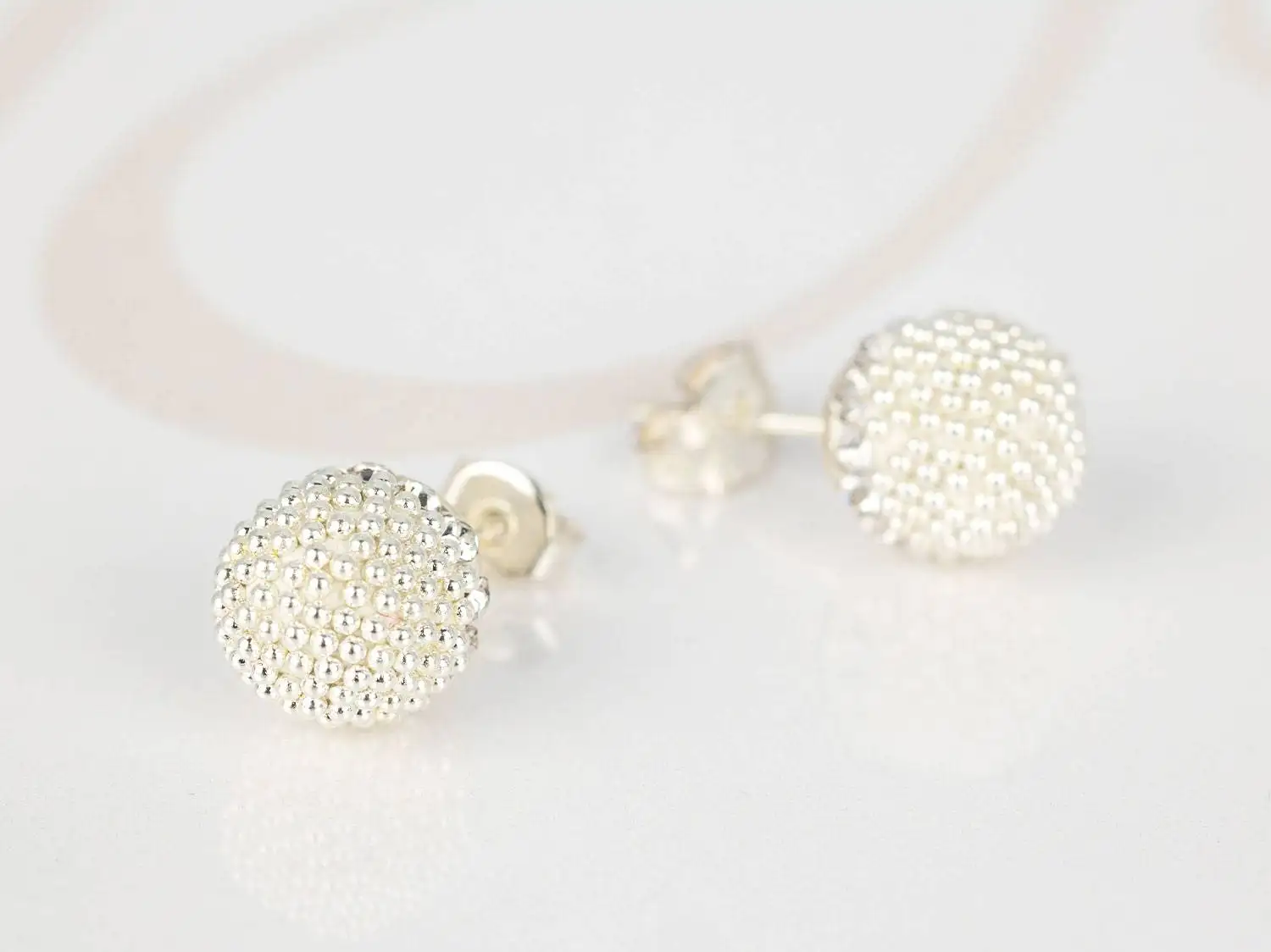 BROQUEL PLATA GRANDE PERLITAS BOLA DE FUEGO