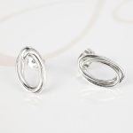 BROQUEL PLATA OVALOS ENTRELAZADOS LISO