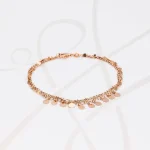 PULSERA CON DIJE PLATA CADENA Y MONEDAS ORO ROSA
