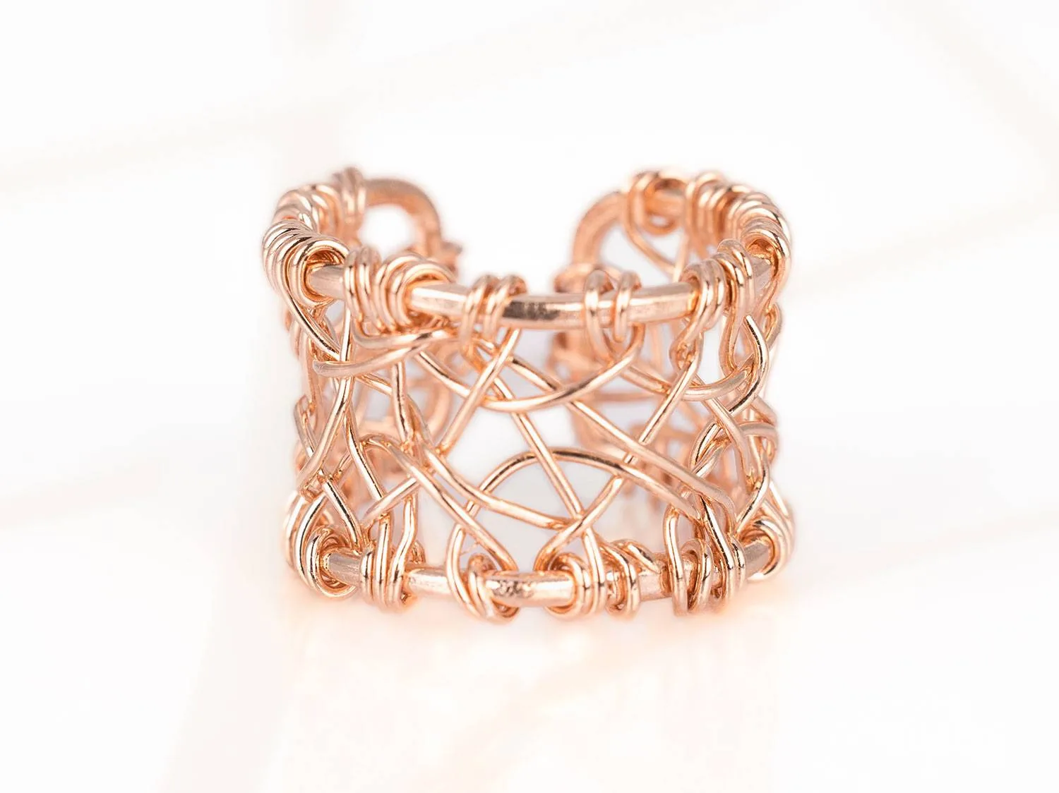 ANILLO RECUBRIMIENTO DE ORO ROSA TEJIDO LISO