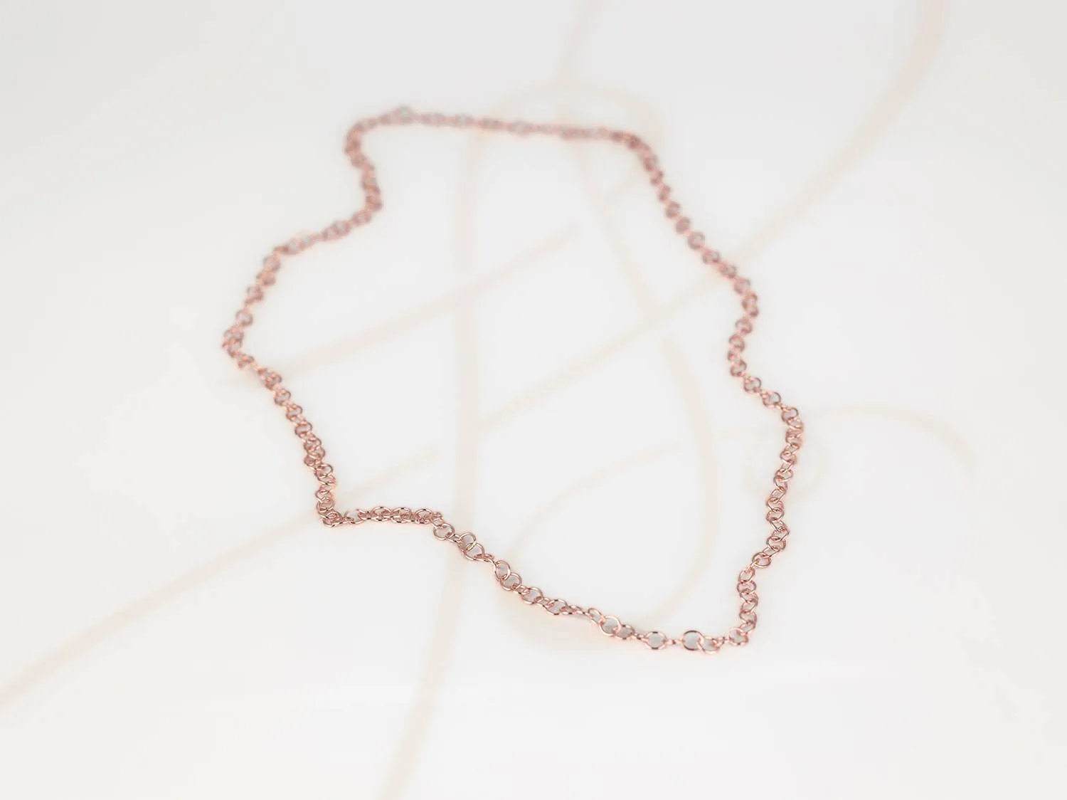 CADENA RECUBRIMIENTO DE ORO ROSA MEDIANA LISA FORZADA