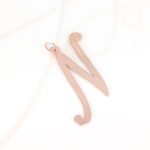 DIJE RECUBRIMIENTO DE ORO ROSA CURSIVA N LISO