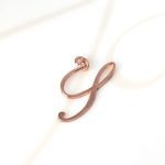 DIJE RECUBRIMIENTO DE ORO ROSA CURSIVA Y LISO