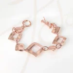 PULSERA SIN DIJE RECUBRIMIENTO DE ORO ROSA ROMBOS ASIMETRICOS LISO